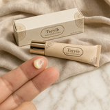 Tayyib Halal Tallow Lip Balm tube with a finger dollop of glossy balm beside it